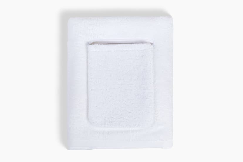 Smart Towel in white, folded with snap-on pocket